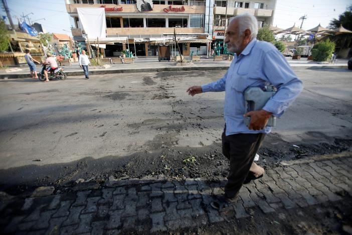 تصاویر | انفجار بستنی‌فروشی در بغداد با ۲۰ کشته 