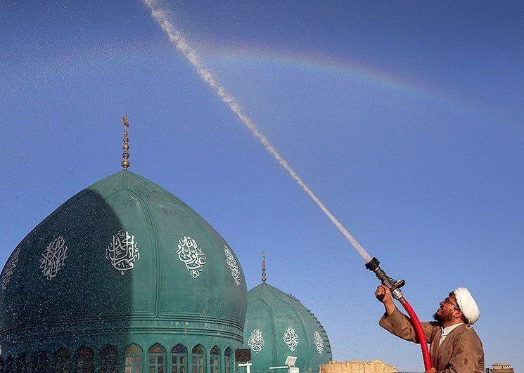 عکس | شست‌وشو و تعویض پرچم‎ گنبد مسجد جمکران