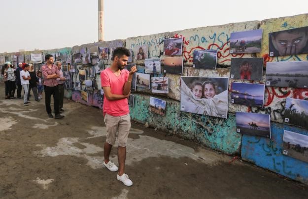 تصاویر | نمایشگاه «هزار عکس از شهر تحت محاصره» در غزه